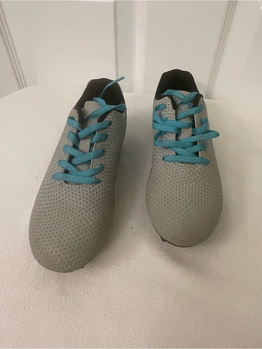DSG Light Gray Kids soccer cleats with Teal Laces